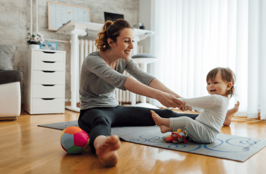 Mother doing Yoga with toddler