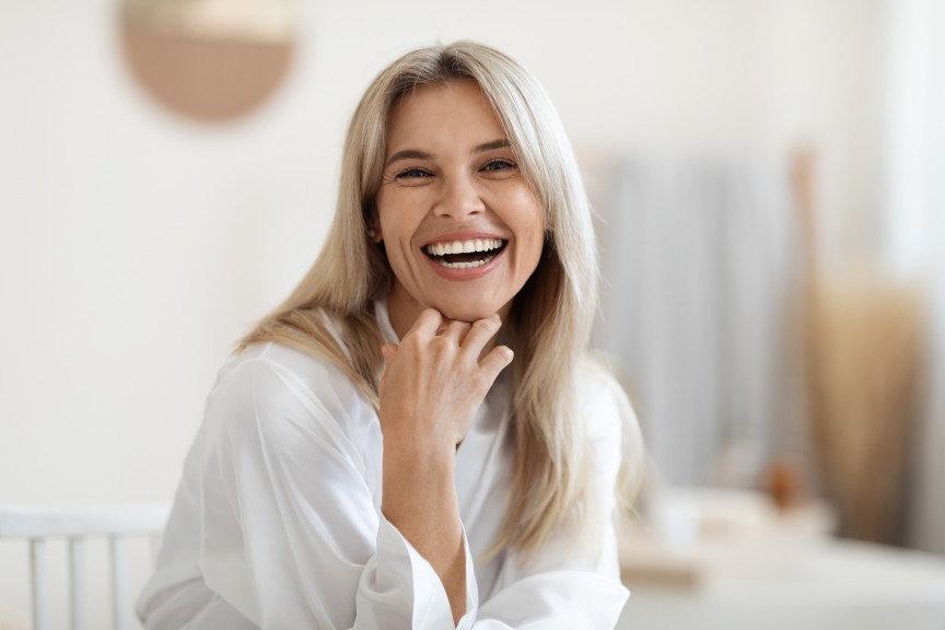 laughing woman with long blonde hair