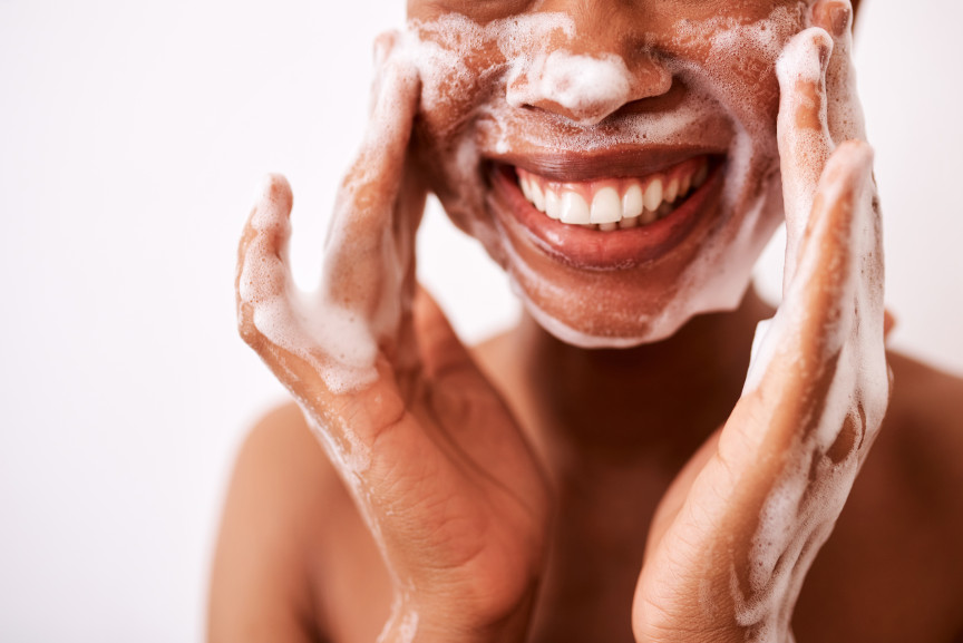 close-up of woman washing face