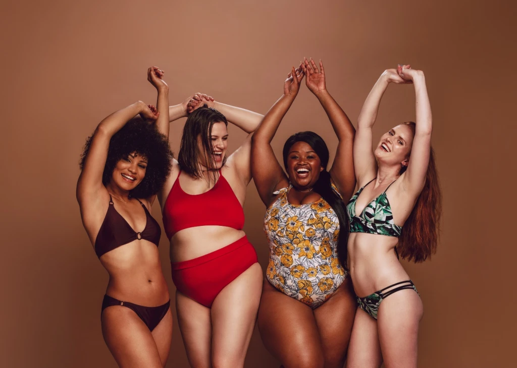 4 women posing in swimwear