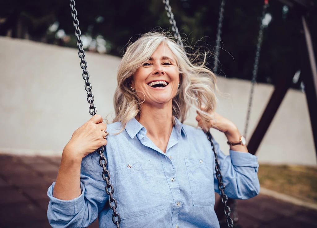 Woman smiling on swing